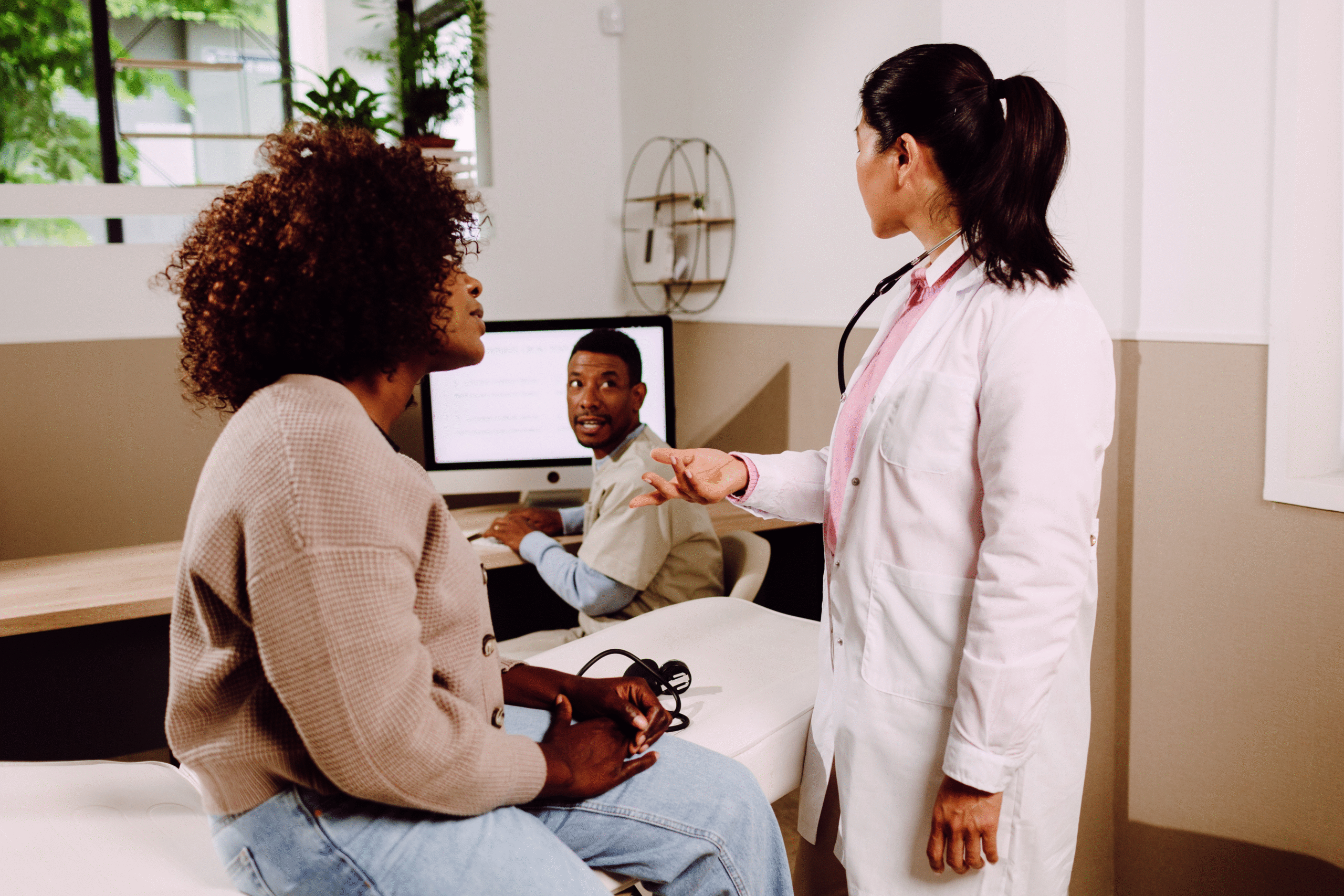 Woman previewing health screening with doctor.